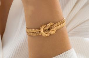 Elegante bracciale con nodo, colore oro